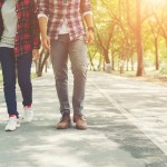 young-teenagers-couple-walking-together-in-park-relaxing-holida